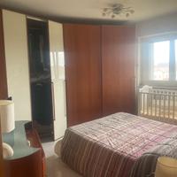 Armadio con ante scorrevoli e con cabina