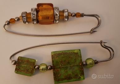 2 spille con perle in vetro di Murano