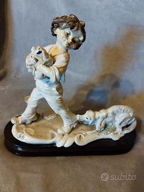 Statuetta porcellana, bambino con il cagnolino