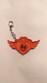 Portachiavi arancione Sailor Moon in resina.