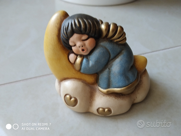 Thun angelo blu su nuvola