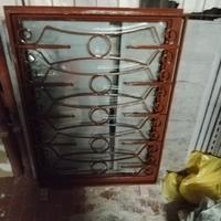 serramento doppio vetro con inferriata in ferro 