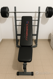 Panca piana con bilanciere e dischi
