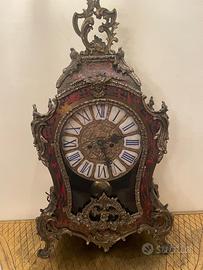 Orologio in bronzo con consolle