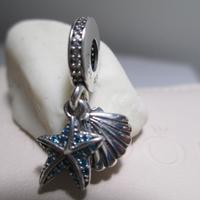 Pandora Charm stella marina tropicale e conchiglia