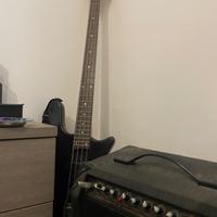 Basso elettrico con amplificatore e asta di suppor
