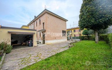 Villetta a schiera con giardino