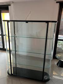 Vetrina in vetro ovale e legno e tavolo vetro