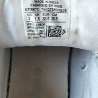 Scarpe bimba bianche pelle All Star Converse.