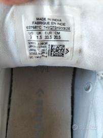 Scarpe bimba bianche pelle All Star Converse.