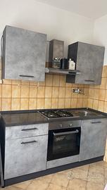 Cucina  color ossido di cemento