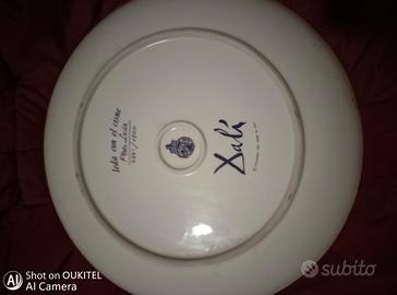 coppia di piatti firmati 