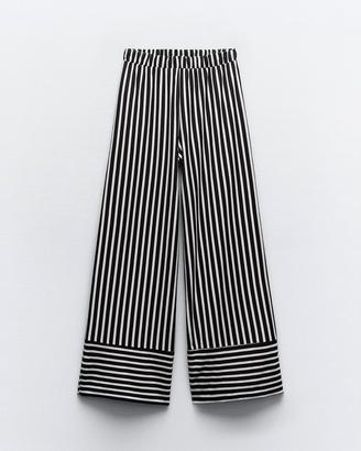 Pantaloni a righe a zampa