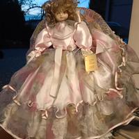 bambola da collezione con seggiolina 