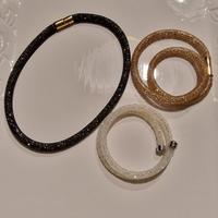 Set 3 bracciali tubolari Swarovsky, nero, beige e 