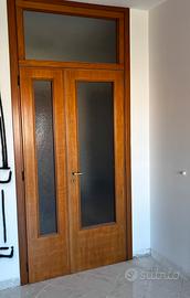 RE.GA.LO.  Porta pregiata in legno e vetro