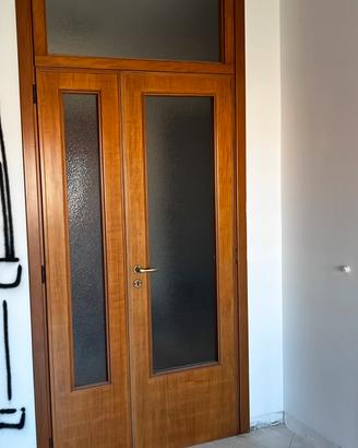 RE.GA.LO.  Porta pregiata in legno e vetro