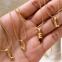 collana con ciondolo lettera acciaio inox col oro