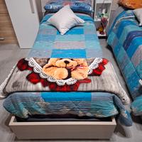 2 letti singoli contenitori con materassi