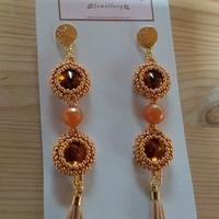 orecchini fatti a mano, toni del bronzo. nuovi