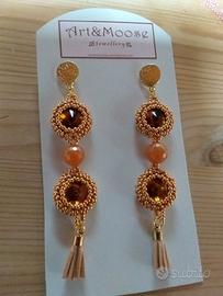 orecchini fatti a mano, toni del bronzo. nuovi