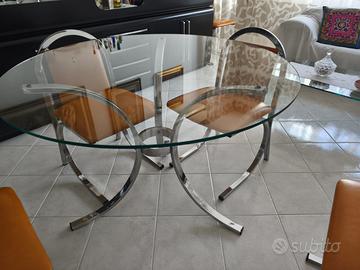 Trattabile.Tavolo rotondo in vetro con 6 sedie.