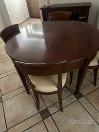Tavolo tondo allungabile in legno  con sedie