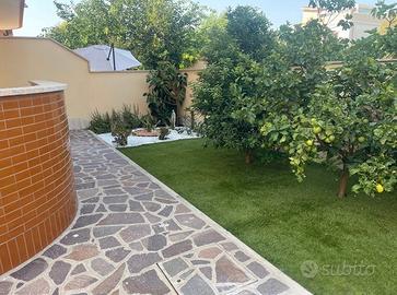 Fiumicino bilocale arredato con giardino privato