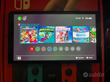 Nintendo switch oled + 4 giochi + pad e altro