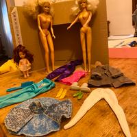 Lotto bambole abiti accessori Barbie Ken ……