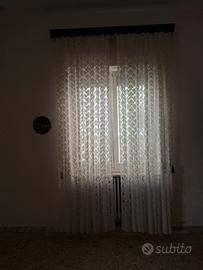 Tende per salotto ricamate