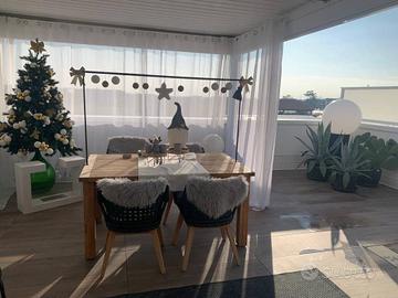 SUPER ATTICO DAL DESIGN MODERNO CON AMPI TERRAZZI