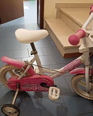 Bici con rotelline per bimba. Sellino regolabile.