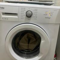 Stanza letto cucina lavatrice