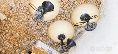 Lampadari in vetro e ferro battuto