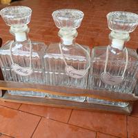 3 bottiglie da collezione con portabottiglie
