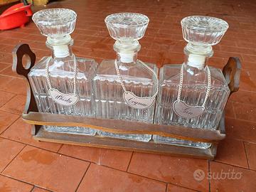 3 bottiglie da collezione con portabottiglie