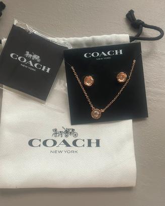 Orecchini e catenina con pendente Coach