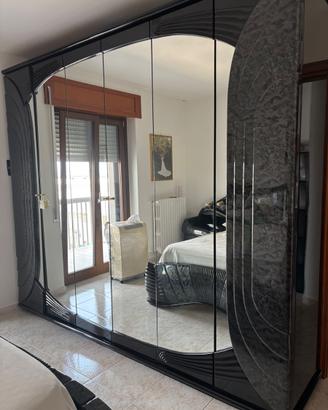 Camera da letto matrimoniale nera lucida con LED