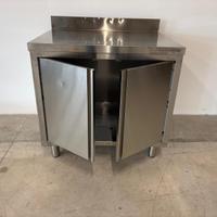 Tavolo armadiato inox con 2 ante. Cm. 90x70x85H.