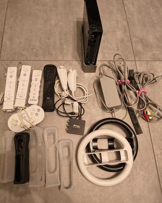 Nintendo Wii + Wii Fit Plus + giochi e accessori