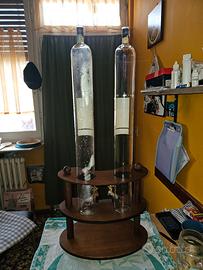 bottiglie di grappa con supporto e rubinetto 
