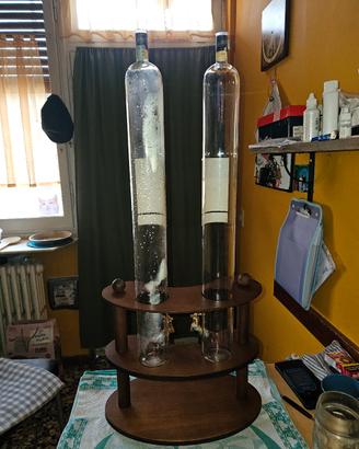 bottiglie di grappa con supporto e rubinetto 
