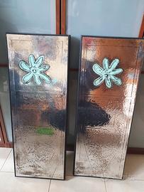 Due quadri su lamina cromata