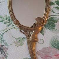 Vecchio specchio in ottone