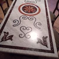 tavolo in marmo con piedi in ferro battuto 