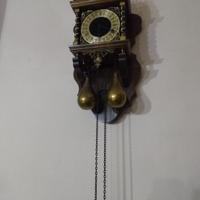 Orologio antico a pendolo da parete