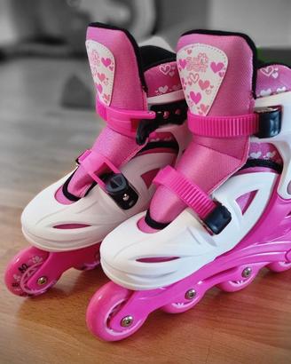 Pattini a 4 ruote regolabili con freno posteriore