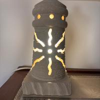 Lampada in tufo a forma di faro