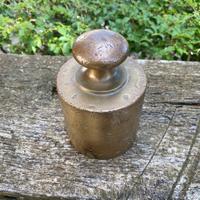 Antico peso ottone